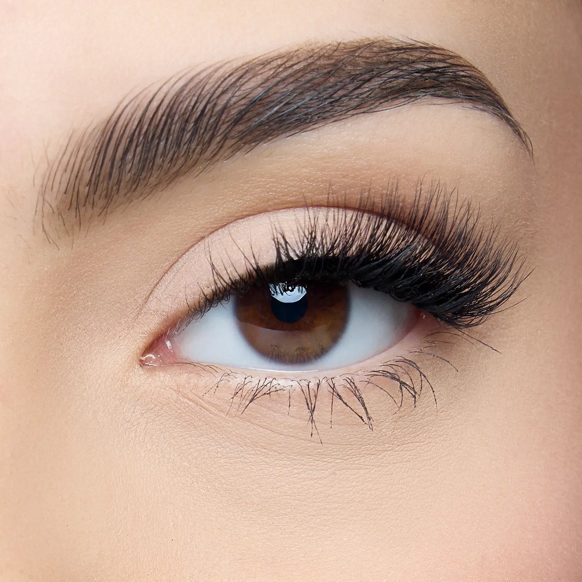 Darken the brows and stack the lashes